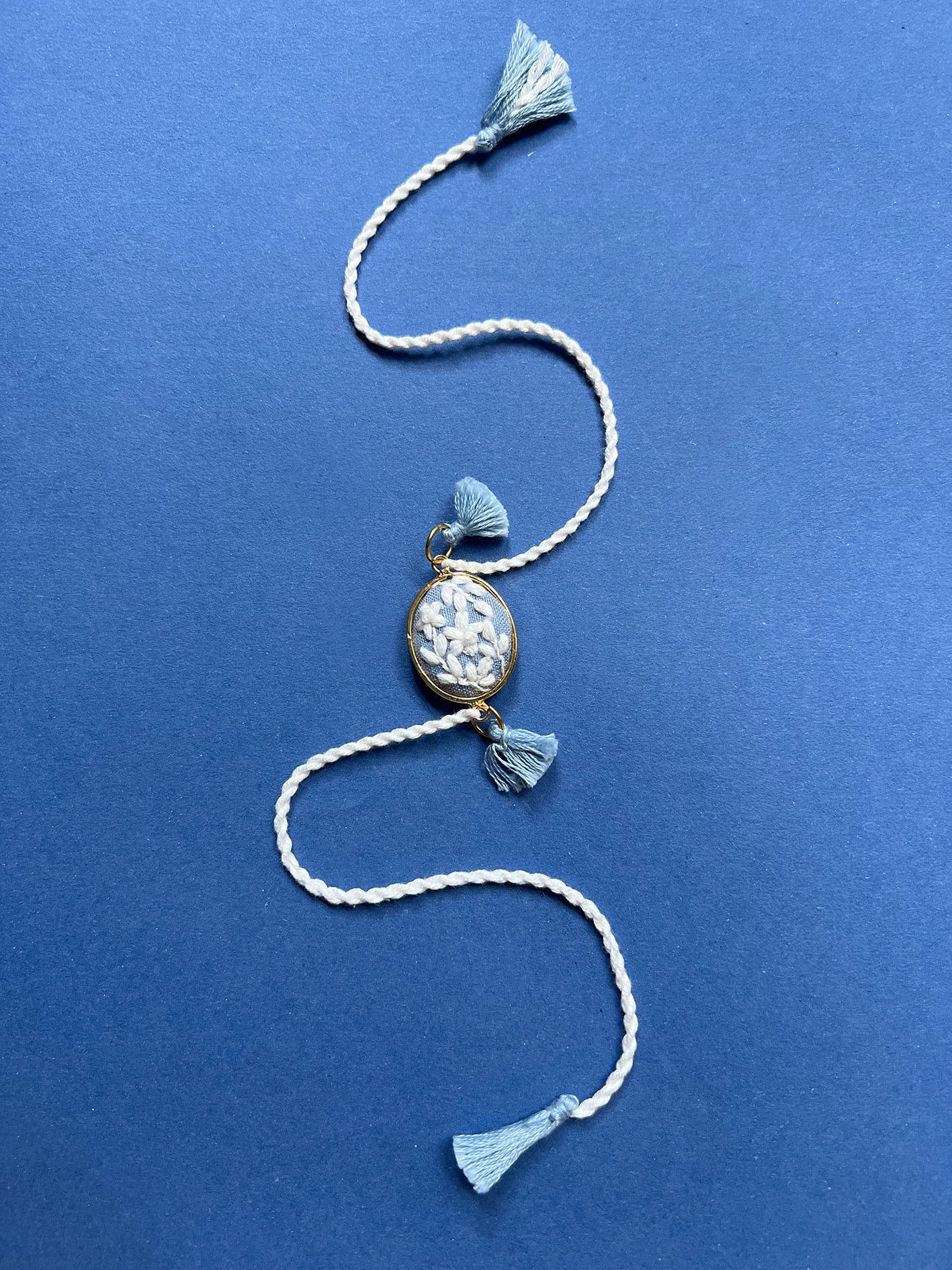 Blue & White Oval Rakhi