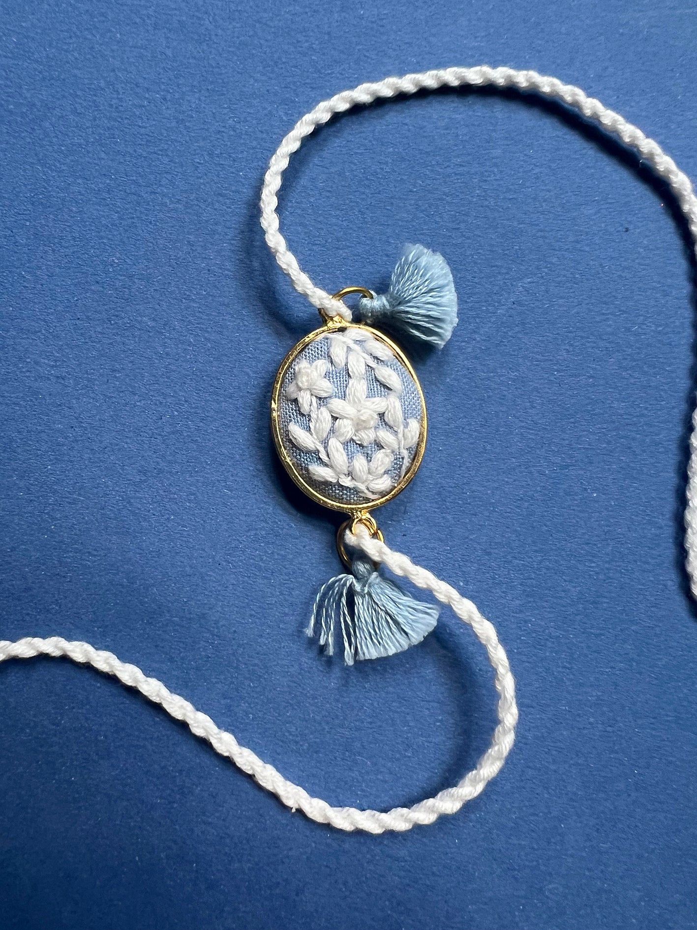 Blue & White Oval Rakhi