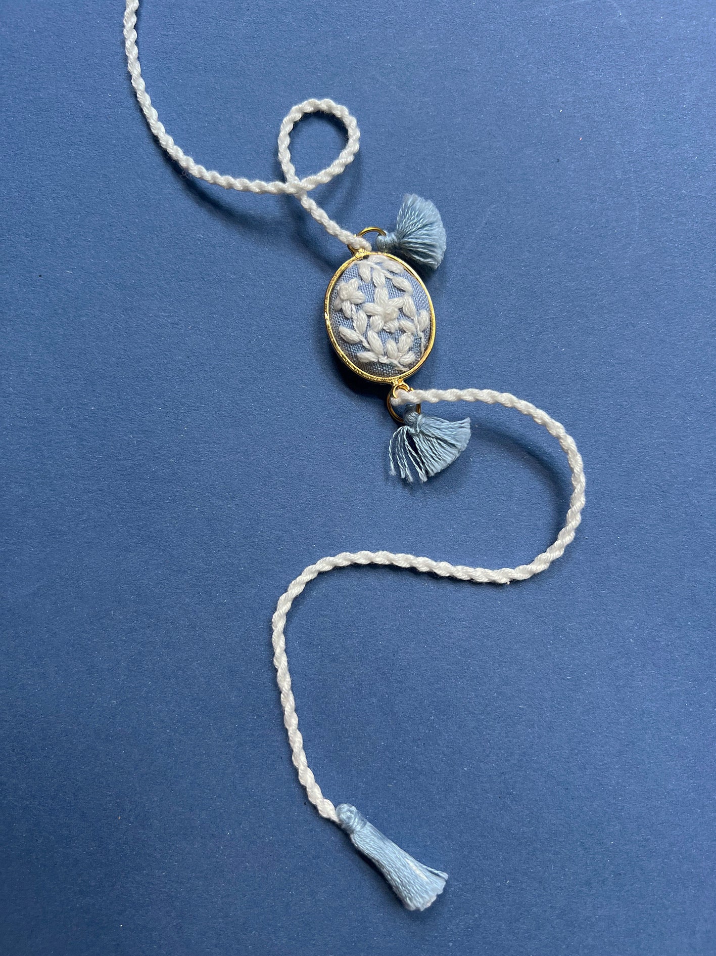 Blue & White Oval Rakhi