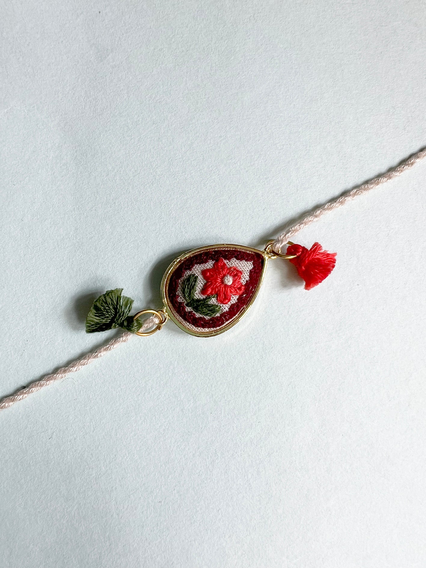 Offwhite Red Floral Drop Rakhi