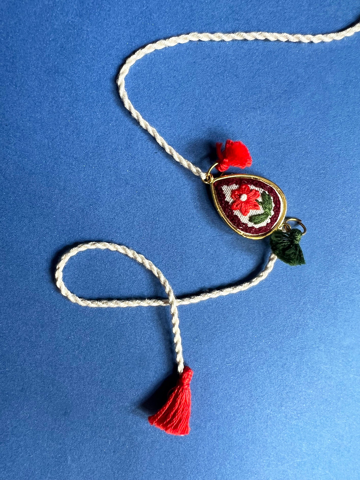 Offwhite Red Floral Drop Rakhi